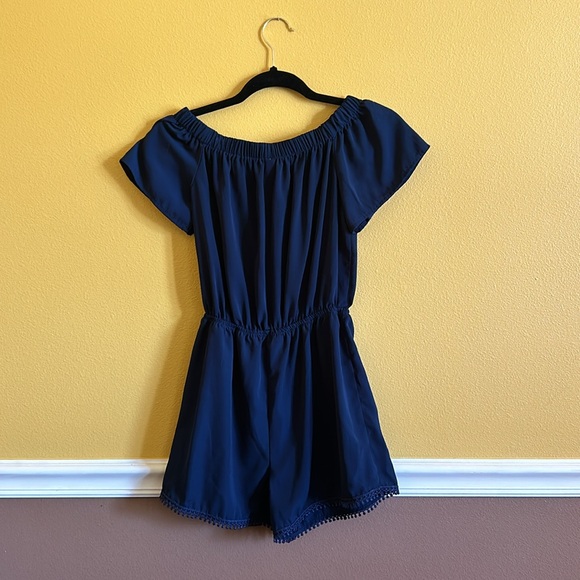A blue romper from Khol’s. Has been worn a couple times but in good shape. - Picture 2 of 4
